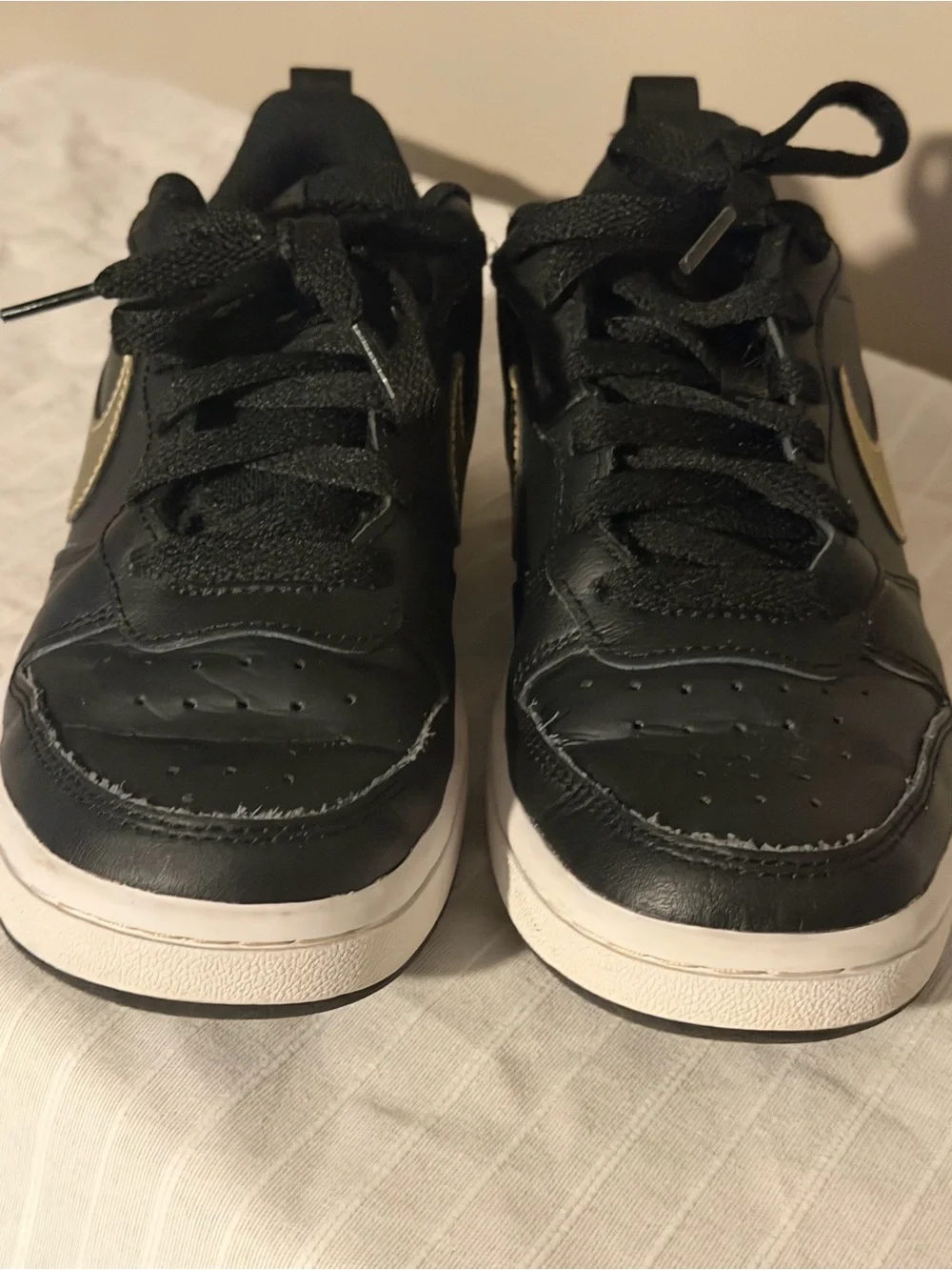 Nike Kids Black Sneakers with Gold Swoosh